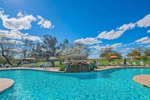a swimming pool with a gazebo in a park at King Bed Remodeled and Walkable Adjacent Kierland Golf in Scottsdale