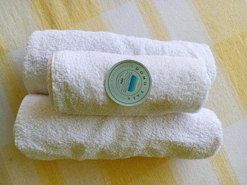 three towels with a sticker on top of them at Domo Yala in Yala