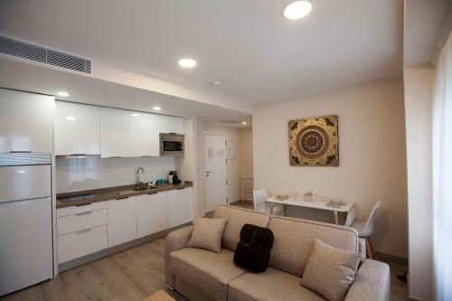 Кухня или мини-кухня в Apartamentos Massò
