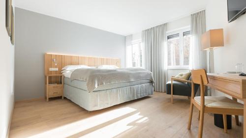 מיטה או מיטות בחדר ב-Hensens Residenz