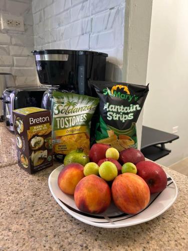 a plate of apples and other food on a counter at Soulful Serenity in Steer Town