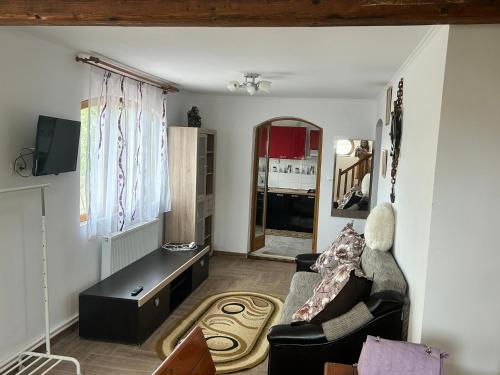 a living room with a couch and a table at Apartaments Doriana in Vama Veche