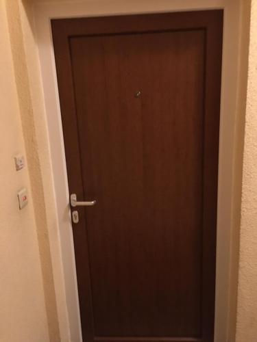 a door in a room with a brown door at One-bedroom Apartment near Atomium in Brussels