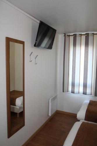 Ένα ή περισσότερα κρεβάτια σε δωμάτιο στο Fasthotel Tours Sud