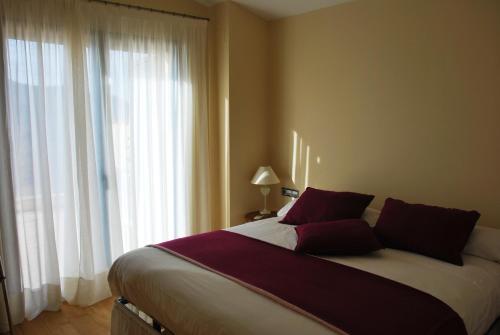 Postel nebo postele na pokoji v ubytování Buil & Gine Wine Hotel