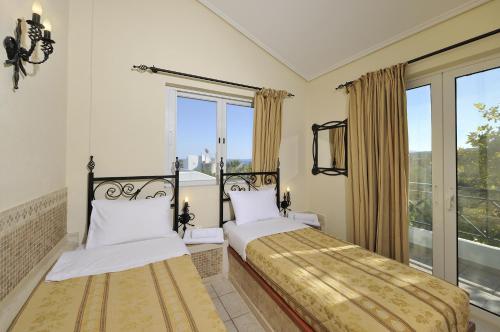 Ένα ή περισσότερα κρεβάτια σε δωμάτιο στο Paris Village Apartments