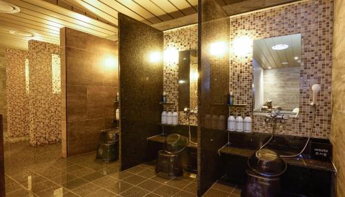 a large bathroom with a sink and a mirror at Dormy Inn SEOUL Gangnam in Seoul