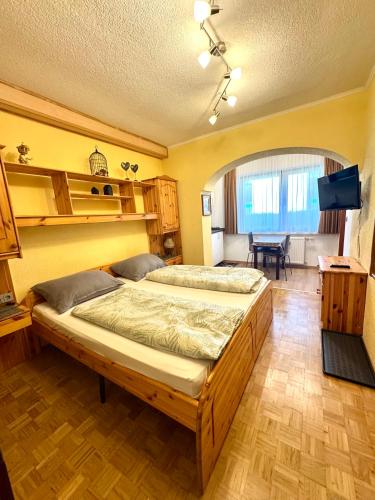 a bedroom with a large bed in a room at Alpenhof M&E in Bad Kleinkirchheim