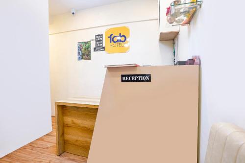a refrigerator with a sign on it in a room at Via 24x7 in Mumbai