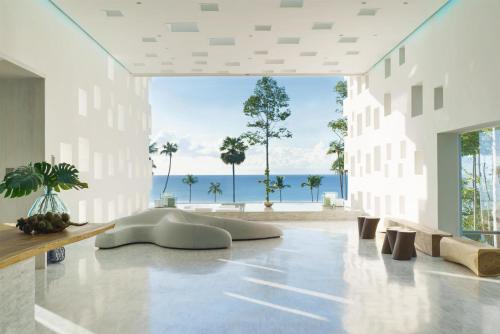 a large white room with a view of the ocean at Hyatt Regency Koh Samui in Chaweng