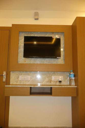 a wall mounted aquarium in a hotel room at SS Residency in Gorakhpur