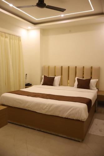 a bedroom with a large bed in a room at SS Residency in Gorakhpur