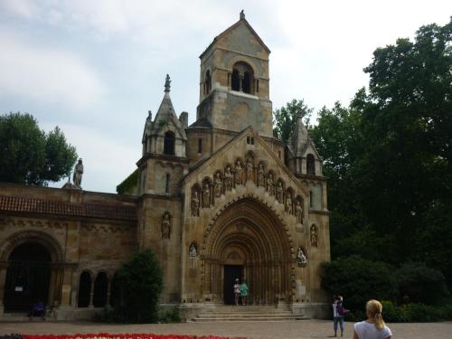 an old church with a tower on top of it at Írisz Apartman Budapest in Budapest