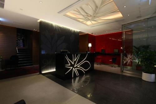 a lobby of a building with red walls at Sohotel in Hong Kong