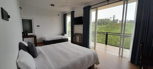 a bedroom with a white bed and a large window at Harrington Heritage in Hatton