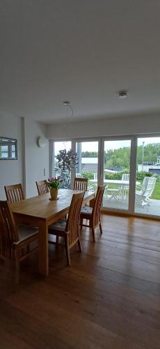 a dining room with a wooden table and chairs at Top Ferienwohnung Herborn in Herborn