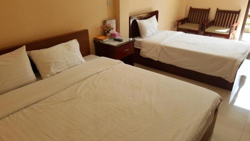Cama o camas de una habitación en Jirasin Hotel & Apartment