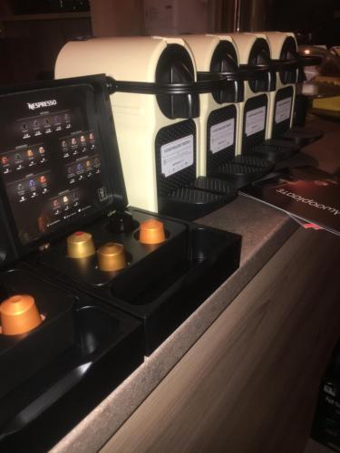 a stove top with a bunch of wine bottles at Ventoura Studios & Apartments in Galissas