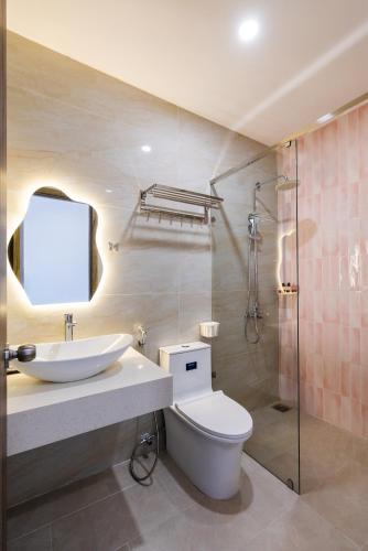 a bathroom with a toilet and a sink and a shower at AuraLite Hotel - Panorama View Đà Lạt in Da Lat