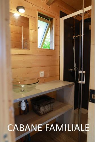 a bathroom with a sink and a shower at Camping de l'Ill in Mulhouse