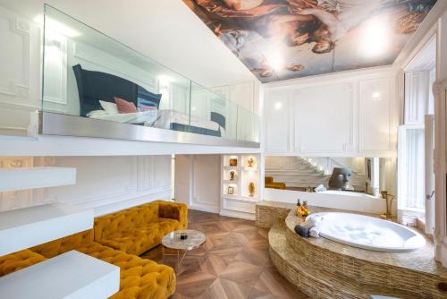 a living room with a couch and a table at VIP Jacuzzi Suites in Budapest