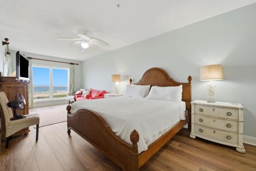 a bedroom with a bed and a dresser and a window at Riviera Dunes 201 in Perdido Key