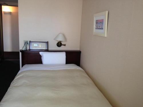 Ένα ή περισσότερα κρεβάτια σε δωμάτιο στο Creston Hotel