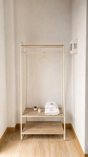 a white shelf in a room with a white wall at OneVillaResort in Ban Son Tap Tao