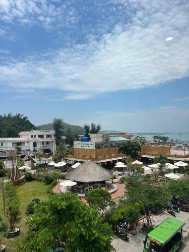 a view of a resort with a bridge and buildings at Thành Đạt Hotel in Đảo Cô Tô