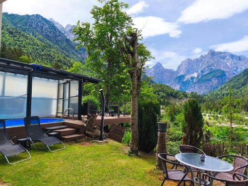 a house with a view of the mountains at Apartments Smolej Kranjska Gora in Kranjska Gora