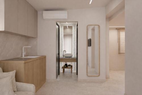 a bathroom with a sink and a mirror at Theera by Premium Key in Skiathos
