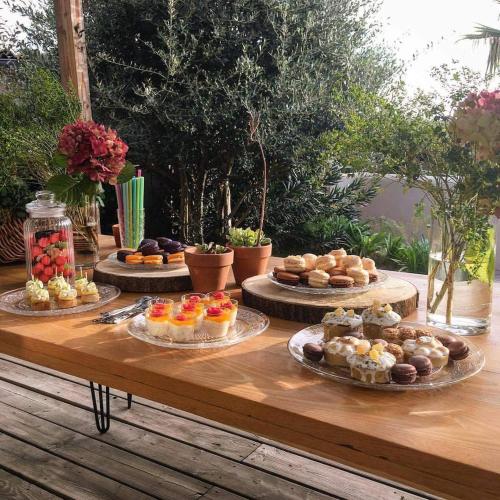 a table with different types of pastries on it at La Villa Les Petits Gardons in Castillon-du-Gard