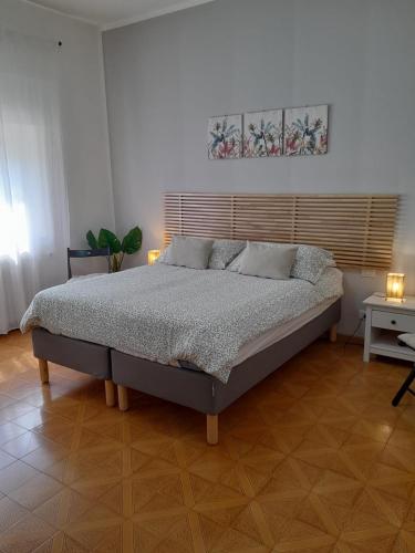 a bedroom with a large bed in a room at BGM apartment Rho Fiera Milan in Cesate