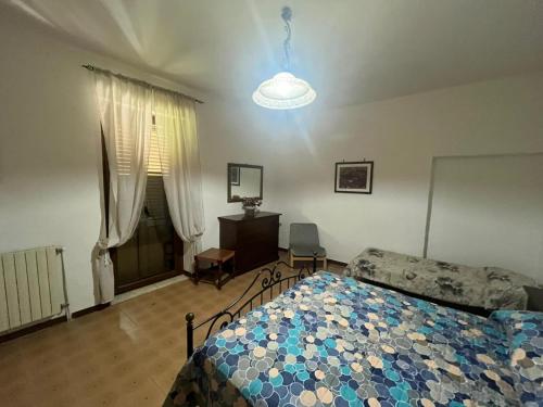 a bedroom with a bed and a lamp in it at La Vertecena in Cantalupo nel Sannio