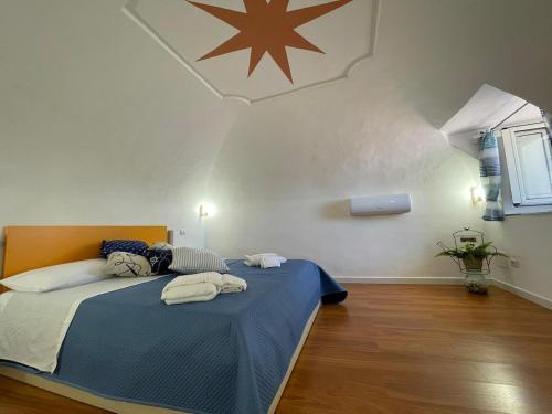 a bedroom with a bed with a star on the ceiling at L'Angolo Vacation Home in Nerano