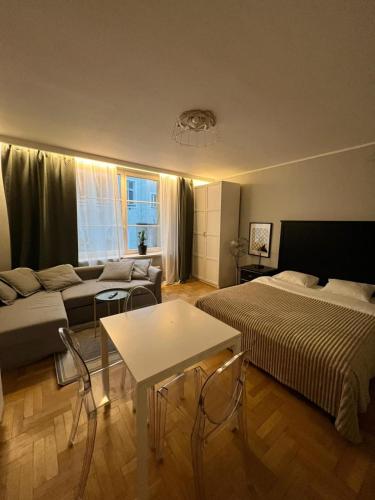 a living room with two beds and a couch at Main Square Sławkowska Apartment in Krakow