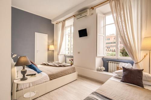 A bed or beds in a room at Vatican Miracle Suite