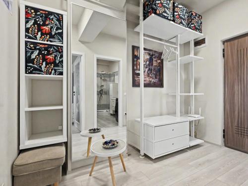 a dressing room with white furniture and a mirror at Konstanzer Q - City Studio - Palas Mall - AC in Iaşi