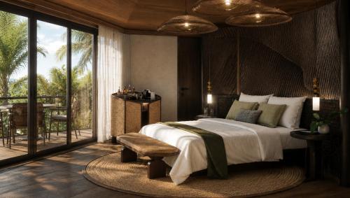a bedroom with a large bed and a balcony at Twinpalms Treehouses Phuket in Bang Tao Beach