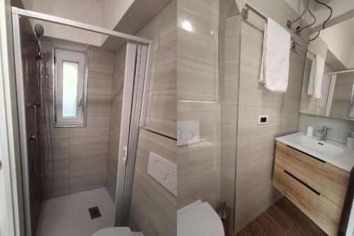 a bathroom with a shower and a toilet and a sink at Torre del Borgo - Centro Storico di Accettura in Accettura