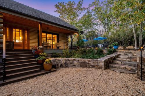 a home with a stone staircase leading to a house at Art & Soul Main House in Lyndhurst