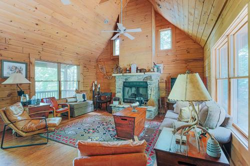 a living room filled with furniture and a fireplace at Bear Tracks Cottage in Nellysford
