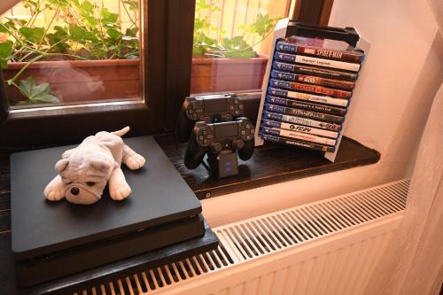 a stuffed elephant sitting on a table next to a window at Casa Lörinczi in Sighişoara