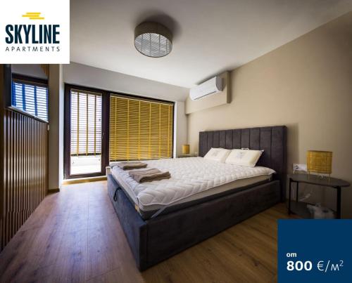 a bedroom with a large bed in a room at Skyline Apartments - Sea View, Pools, SPA&Free Parking in Varna City