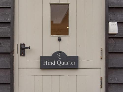a white door with a sign that reads mind quarter at Quarter Cottage in Biddenden