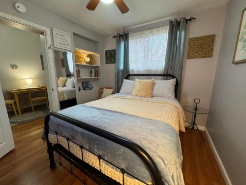 a bedroom with a large bed in a room at Jefferson Carriage House Hideaway in Huntington
