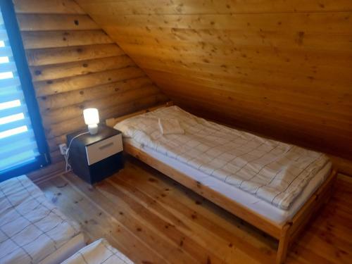 En eller flere senge i et værelse på Osada Notecka