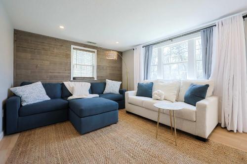 a living room with a blue and white couch at Prime Weeks Still Available, Renovated, Beaches! in Yarmouth
