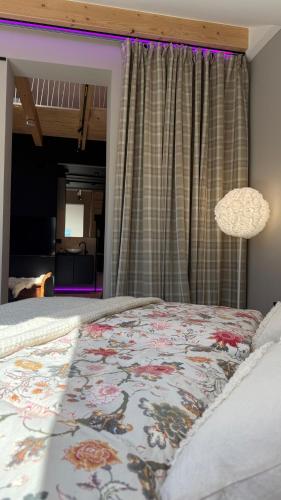 a bedroom with a bed with a rug on it at Gleisbett 12-3 in Meiningen
