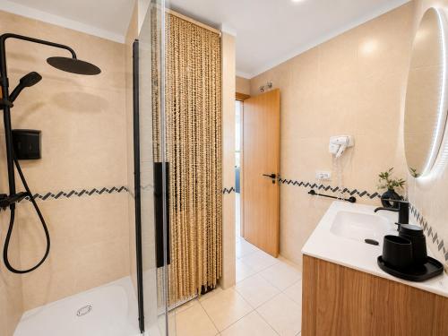 a bathroom with a shower and a sink at Ocean View in Puerto de Santiago